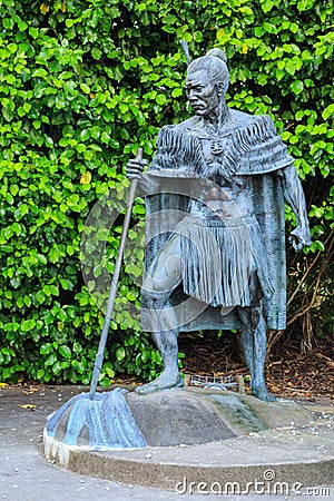 A statue of a New Zealand Maori chief in traditional dress Editorial Stock Photo