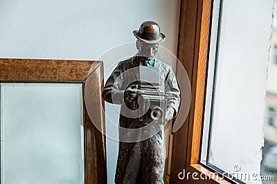 A statue of a nineteenth century photographer with old fashioned photo camera Editorial Stock Photo