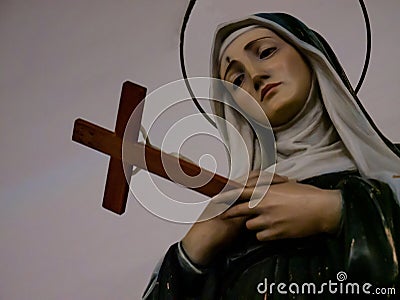 statue of the nun saint rita holding the cross of jesus christ Editorial Stock Photo