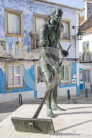 statue of the salt miner monument by the sculptor Francisco Simões set in Praça da Republica in the locality of alcochete Editorial Stock Photo