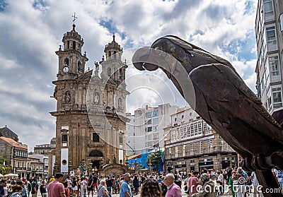 Statue of the parrot of Ravachol in the Plaza de la Peregrina in Pontevedra with the church of the Pilgrim Virgin Editorial Stock Photo