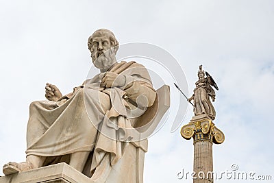 Statue of Plato and goddess Athena against cloudy sky, Athens, Greece Stock Photo