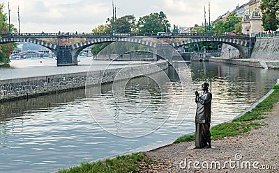 Statue of a praying monk Editorial Stock Photo