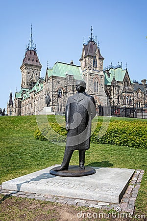Statue of prime Minister Mackenzie King in front of the East block of the Parliament of Canada , Ottawa, Ontario, Canada Editorial Stock Photo