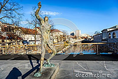 Statue of Prometheus on Butchers` bridge over river Ljubljanica, Stock Photo