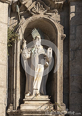 Statue of the Prophet Elijah on the left side of the entrance to the Carmo Church in Porto, Portugal. Stock Photo