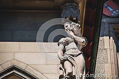 Statue of the right side of the Town hall building of Bern Switzerland that depicts lie and cowardice Stock Photo