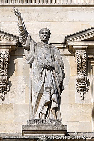 Statue of Saint Bernard on facade of the Louvre palace, Paris, France Editorial Stock Photo