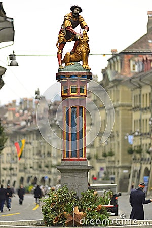 Statue of the Samson Fountain at Kramgasse street in Bern, Switz Editorial Stock Photo