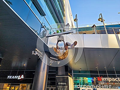 A statue of Shaquille O'Neal dunking a basketball a Lakers uniform in front of Crypto.com Arena in Los Angeles California Editorial Stock Photo