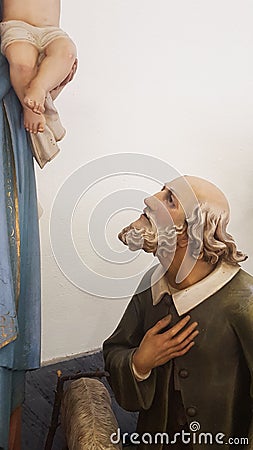 Statue of a shepherd in adoration of the Virgin Mary with Baby Jesus Stock Photo