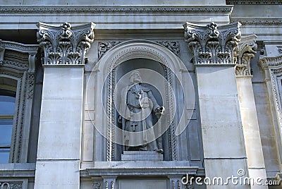 Statue of Sir Richard Whittington, Royal Exchange facade in London, England Stock Photo