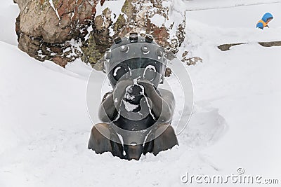 Statue titled The Child from Mars 2003, Author Jaroslav Rona, Jested tower, transmitter and mountain hotel, snow, Frosty foggy Editorial Stock Photo