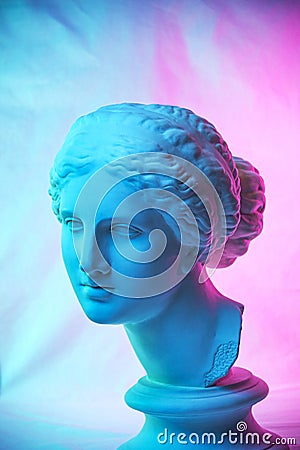 Statue of Venus de Milo. Creative concept colorful neon image with ancient greek sculpture Venus or Aphrodite head Editorial Stock Photo