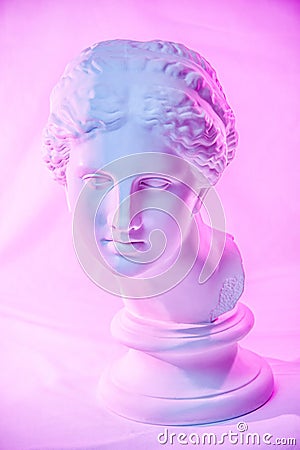 Statue of Venus de Milo. Creative concept colorful neon image with ancient greek sculpture Venus or Aphrodite head Editorial Stock Photo