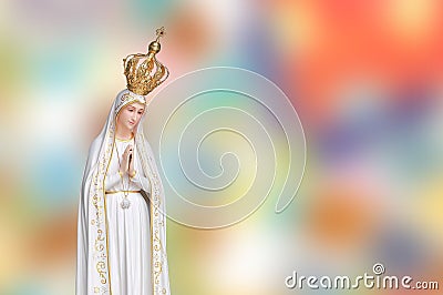 Statue virgin Mary Fatima of the Catholic Church on blur colorful background Stock Photo
