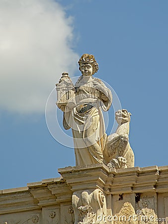 Statue of a woman holding a lantern, detail of the medieval city gate f Alba Iulia Editorial Stock Photo