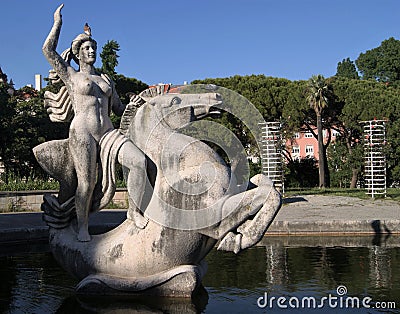 Statue of a woman and horse in a park pond in Lisbon Stock Photo