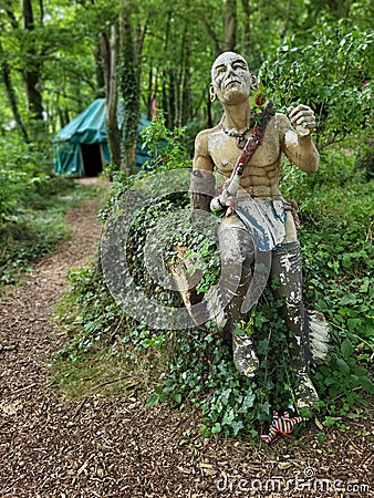 Statue in the woods, weathered, creepy, eery Stock Photo