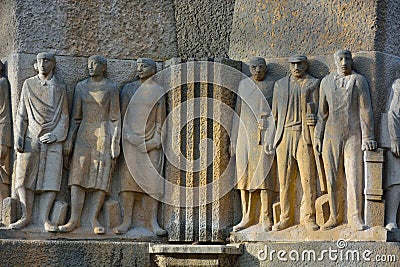 Statue of a working force part of a fontaine Stock Photo