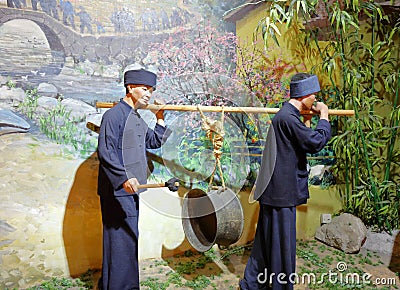 Statue of Zhuang farmers playing drum in Anthropology Museum Of Guangxi, adobe rgb Editorial Stock Photo
