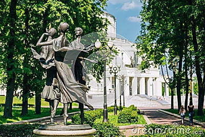 Statues depicting three graceful ballerina dancing in the park near the building of the National Academic Bolshoi Opera Editorial Stock Photo