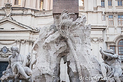 Statues at the foot of the obelix of Piazza Navona in Rome Stock Photo