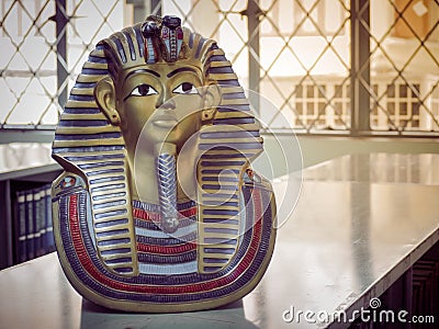 Statues of king pharaoh on a bookshelf Stock Photo