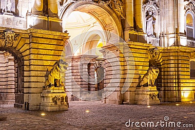 Statues of lions at royal palace of Buda at night, Budapest, Hungary Stock Photo