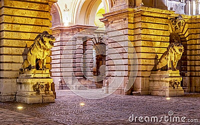 Statues of lions at royal palace of Buda at night, Budapest, Hungary Stock Photo