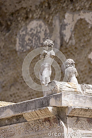 Statues on the pedestal of the monument of Marcus Nonius Balbus, Herculaneum, Campania, Italy Editorial Stock Photo