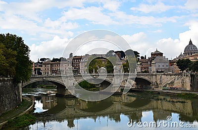 Statues on the Ponte Vittorio Emmanuele II with the Saint Peters Basilica in the Background - Rome, Italy Editorial Stock Photo