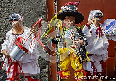 Pulcinella lucky charm and red horns at the souvenir shop in Naples Editorial Stock Photo