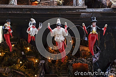 Pulcinella lucky charm and red horns at the souvenir shop in Naples Editorial Stock Photo