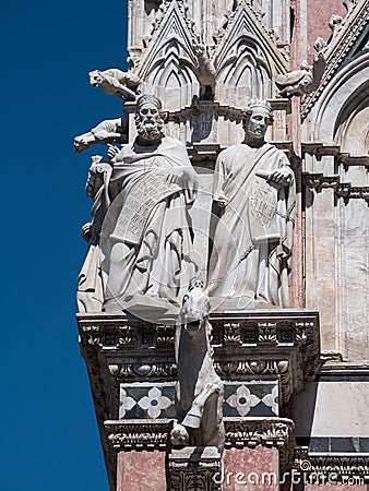 Statues at the west facade of Siena cathedral Stock Photo