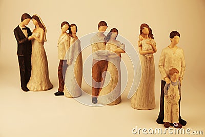 Statues of a young couple in various stages of life Stock Photo