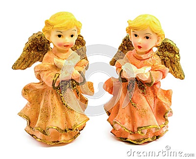 Statuettes of porcelain angels with book and pigeon isolated on white background Stock Photo