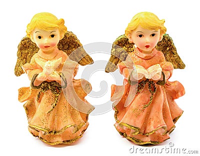 Statuettes of porcelain angels with book and pigeon isolated on white background Stock Photo