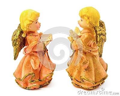 Statuettes of porcelain angels with book and pigeon isolated on white background Stock Photo