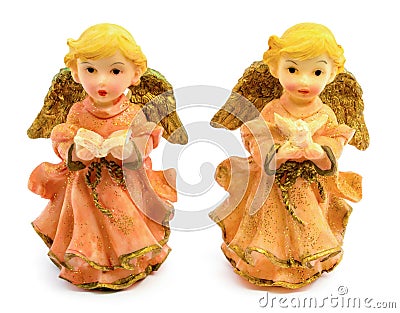 Statuettes of porcelain angels with book and pigeon isolated on white background Stock Photo