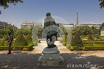 A statue in the manicured garden of Les Invalides Paris Editorial Stock Photo