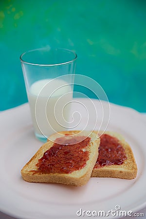 Stawberry jam toast with a glass of milk Stock Photo