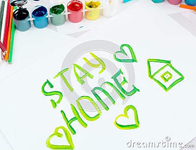 Stay at home. Children`s drawing with gouache paints on a white sheet.Campaign on social networks for the prevention of Stock Photo