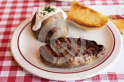 Steak and baked potato Stock Photo