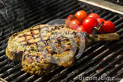 Steak flame broiled on a barbecue Stock Photo