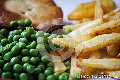 STEAK PIE CHIPS AND PEAS Stock Photo