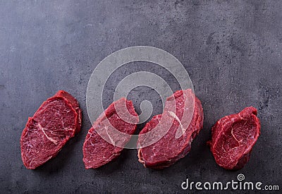 Steak. Raw beef steak. Fresh raw Sirloin beef steak sliced o Herb - Rosemary decoration Stock Photo