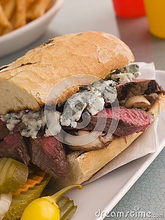 Steak and Roquefort Sandwich with Fries Gherkins Stock Photo