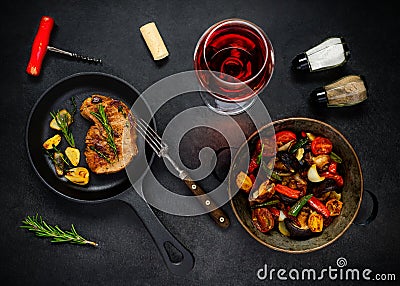 Steak, Vegetables and Glass Rose Wine Stock Photo