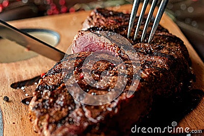 Steak on a wooden board Stock Photo